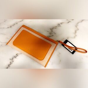 Kate spade nwt Orange and White Striped Wristlet turmeric NEw 9x6